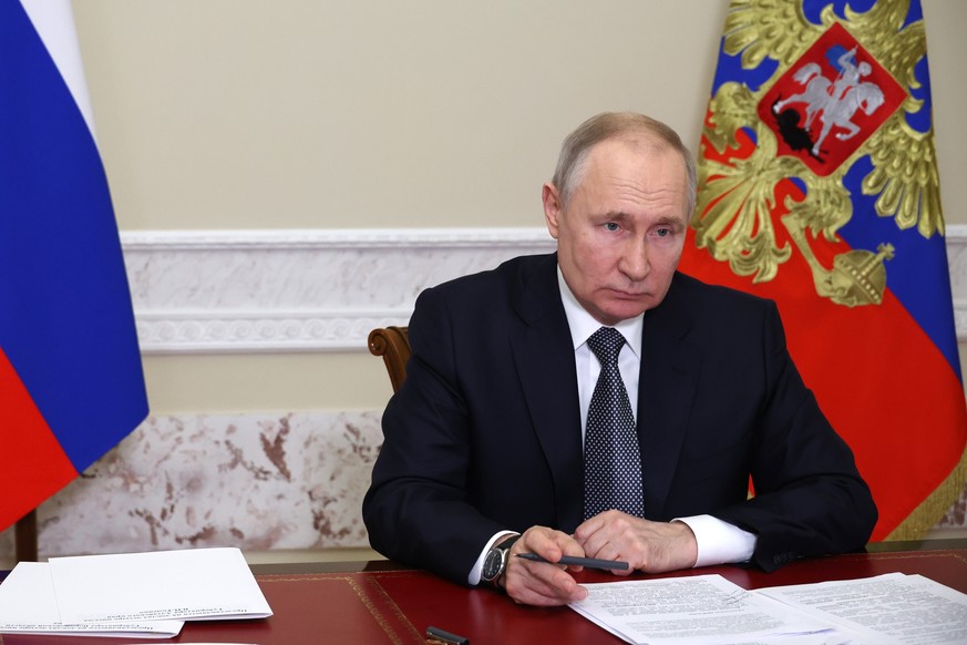 Russian President Vladimir Putin speaks to Altai Territory Governor Viktor Tomenko during their meeting via videoconference in Moscow, Russia, Tuesday, May 2, 2023. (Mikhail Klimentyev, Sputnik, Kreml ...