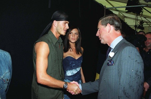 Right: HRH THE PRINCE OF WALES Meeting Left: DAVID BECKHAM Manchester Utd FC and England International Footballer and his wife VICTORIA BECKHAM Posh Spice British Pop Singer Member of The Spice Girls  ...