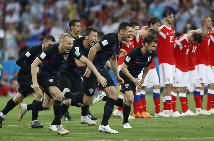 Croatia players celebrate after scoring last penalty spot in a shootout at the end the quarterfinal match between Russia and Croatia at the 2018 soccer World Cup in the Fisht Stadium, in Sochi, Russia ...