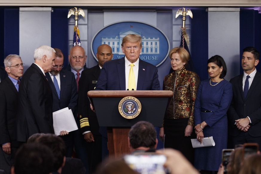 President Donald Trump pauses as he arrived to speak in the briefing room of the White House in Washington, Monday, March, 9, 2020, about the coronavirus outbreak as Dr. Anthony Fauci, director of the ...