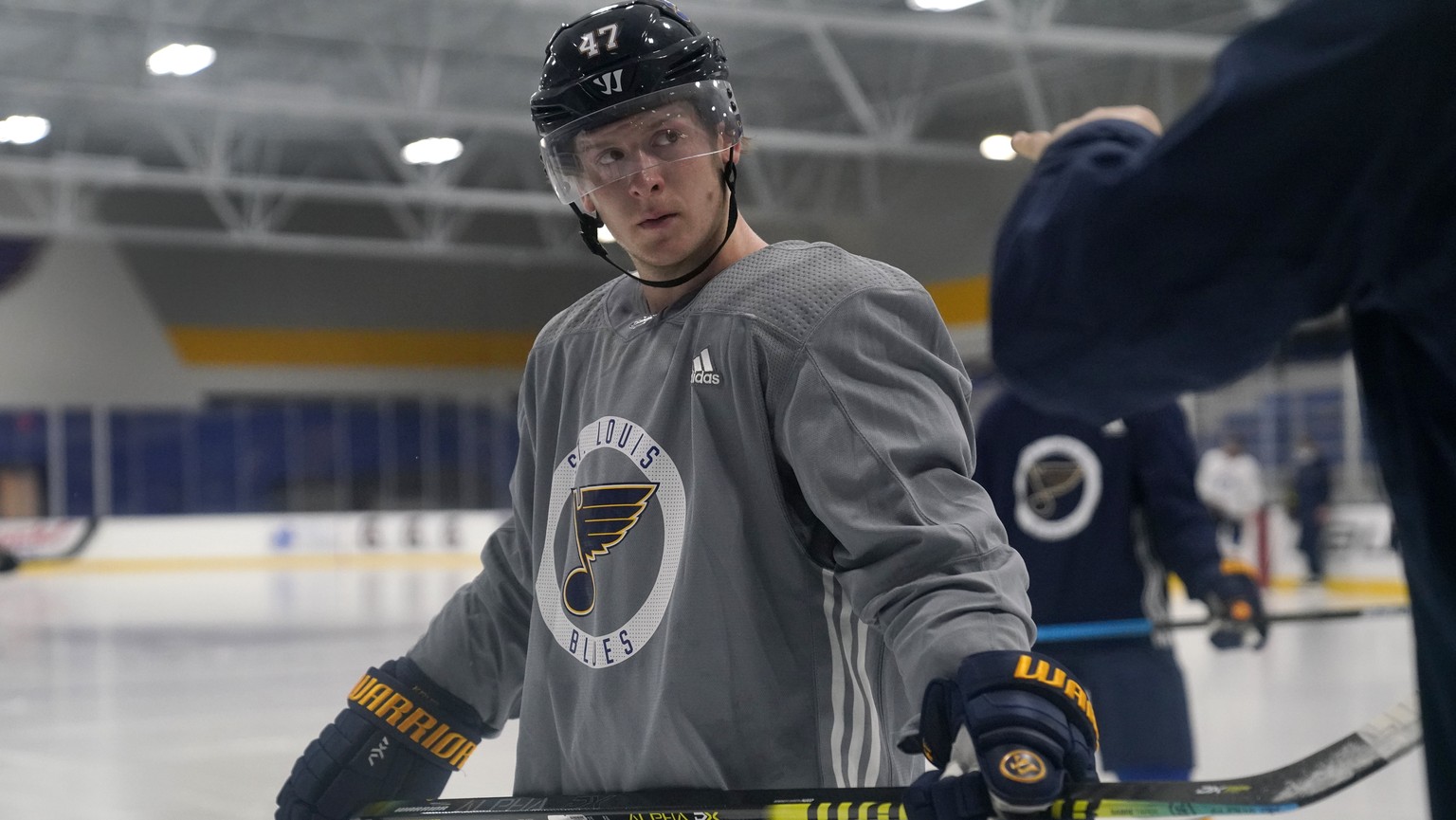 St. Louis Blues' Torey Krug listens to a member of the coaching staff during NHL hockey training camp Tuesday, Jan. 5, 2021, in Maryland Heights, Mo. (AP Photo/Jeff Roberson)