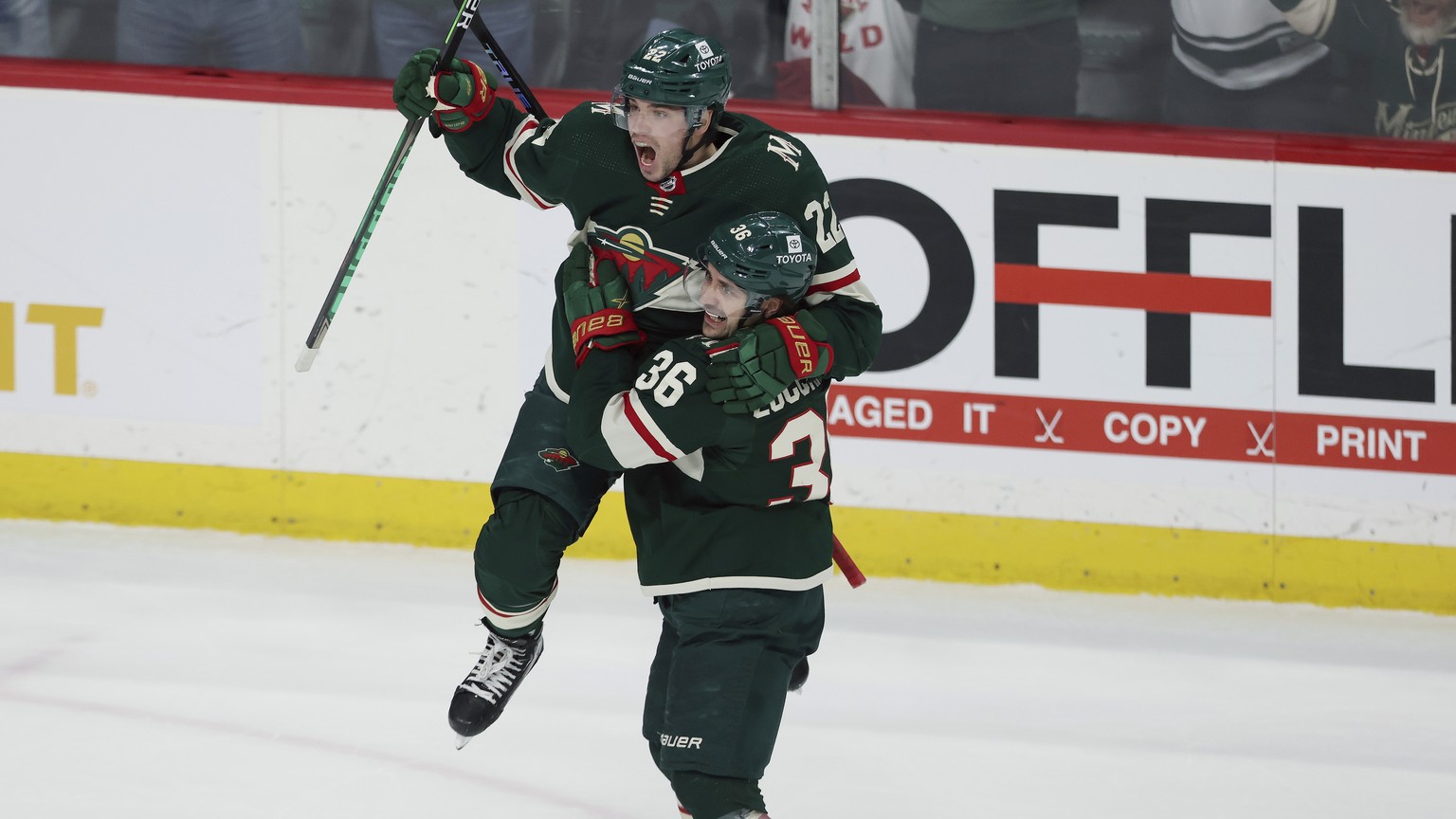 Minnesota Wild left wing Kevin Fiala (22) reacts with right wing Mats Zuccarello (36) after scoring the game winning goal in overtime against the Colorado Avalanche during an NHL hockey game Sunday, M ...