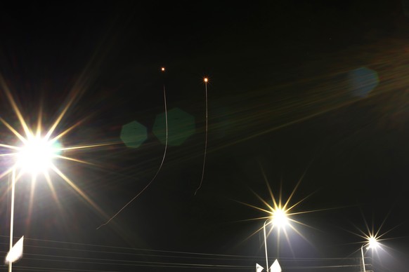epa11277706 The Israeli Iron Dome (air defense system) intercepts missiles launched from southern Lebanon, near Kiryat Shemona, in northern Israel, 14 April 2024. According to the Israeli army IDF on  ...