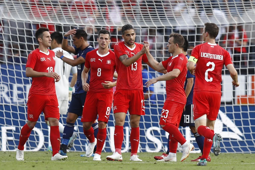 Switzerland&#039;s Ricardo Rodriguez, center, celebrates with his teammates Mario Gavranovic, Remo Freuler, Xherdan Shaqiri and Stephan Lichtsteiner, from left, after scoring the 1-0 during an interna ...