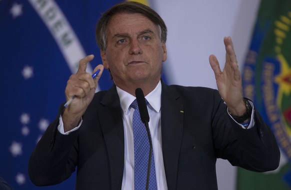 epa09896454 The President of Brazil, Jair Bolsonaro, participates in the hiring ceremony of the first doctors of the Doctors Program for Brazil, at the Planalto Palace, in Brasilia, Brazil, 18 April 2 ...