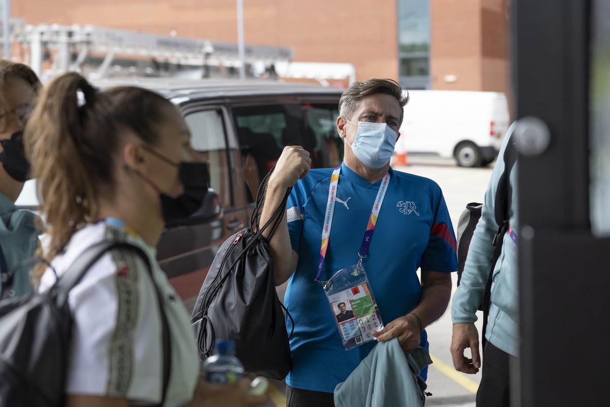 Switzerland's forward Ramona Bachmann, left, and Switzerland's head coach Nils Nielsen, right, arrive for a press conference one day before the soccer match against the Sweden, during the UE ...