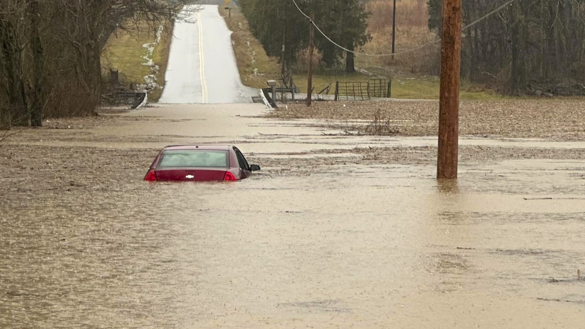 This photo provided by the Warren County, Ky., Sheriff's Office shows a partially submerged car outside of Bowling Green, Ky., on Saturday, Feb. 15, 2025. (Warren County Sheriff's Office via ...