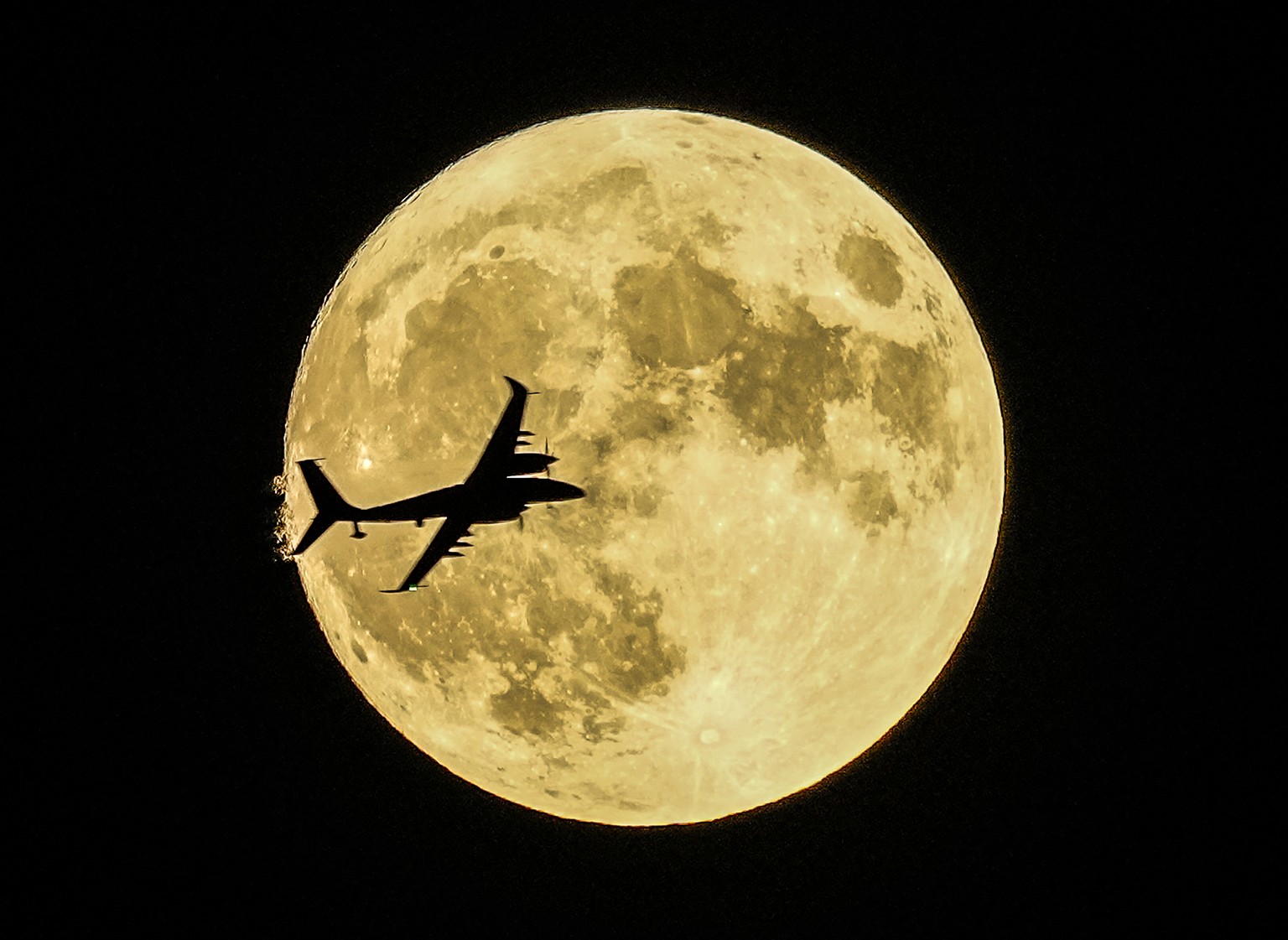 Ak?nc? unmanned aerial craft passes in front of the Supermoon during a demonstration flight on the first day of Teknofest technology and aerospace festival in Ankara, Turkey, Wednesday, Aug. 30, 2023. ...