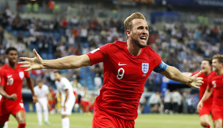 epa06819877 Harry Kane (C) of England celebrates after scoring the winning goal during the FIFA World Cup 2018 group G preliminary round soccer match between Tunisia and England in Volgograd, Russia,  ...