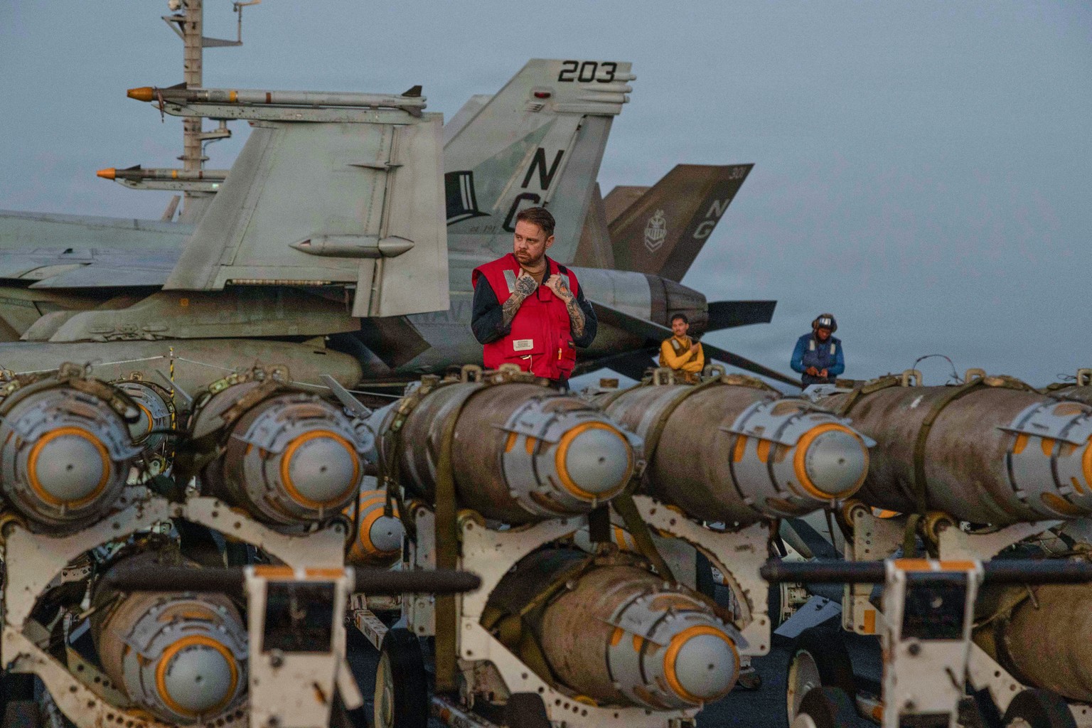 This image provided by U.S. Central Command shows Navy sailors transferring ordnance on the flight deck of Nimitz-class aircraft carrier USS Abraham Lincoln (CVN 72) on Friday, Feb. 27, 2026. (U.S. Na ...