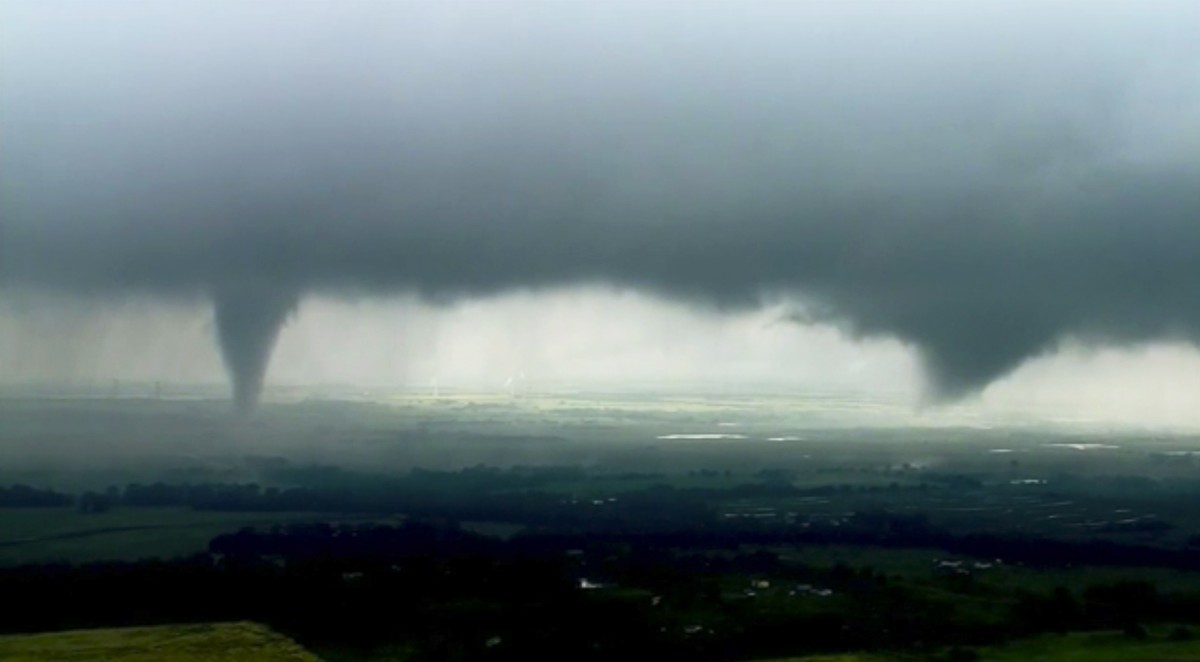This image made from video provided by KWTV-KOTV shows two funnel clouds formed in Crescent, Okla., Monday, May 20, 2019. An intense storm system that weather forecasters labeled "particularly da ...