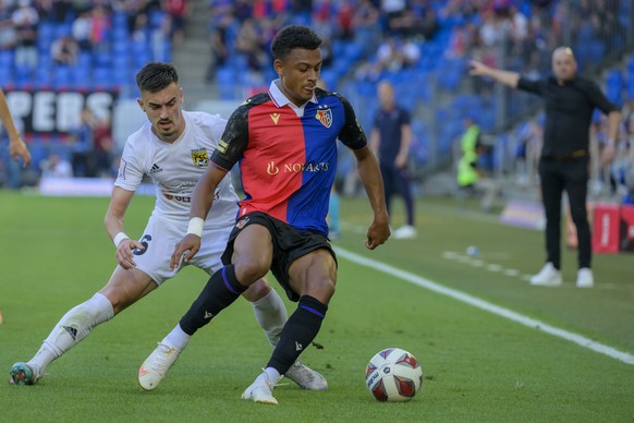 Tobol&#039;s Jovan Ilic, left, against Basel&#039;s Dan Ndoye, right, during the UEFA Conference League second qualifying round first leg match between Switzerland&#039;s FC Basel 1893 and Kazakhstan& ...