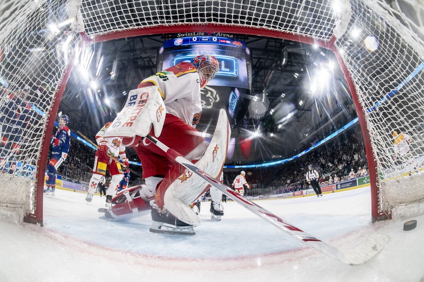 Biel goaltender Joren van Botelbergh shoots a shot from the goal during the first National League ice hockey playoff game between the ZSC Lions and EHC Biel, Saturday, March 16, 2024, in Switzerland.