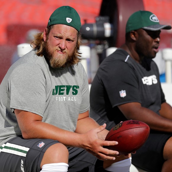FILE - New York Jets center Nick Mangold, left, sits on the bench before an NFL preseason football game against the Washington Redskins, Friday, Aug. 19, 2016, in Landover, Md. (AP Photo/Mark Tenally, ...