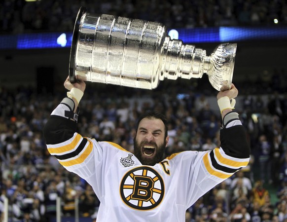 FILE - Boston Bruins' Zdeno Chara, of Slovakia, hoists the cup following the Bruins' 4-0 win over the Vancouver Canucks in Game 7 of the NHL hockey Stanley Cup Finals on June 15, 2011, in Va ...