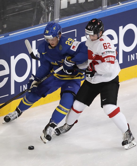 Switzerland&#039;s Denis Malgin, right, challenges Sweden&#039;s William Nylander, left, during the Ice Hockey World Championships quarterfinal match between Switzerland and Sweden in the AccorHotels  ...