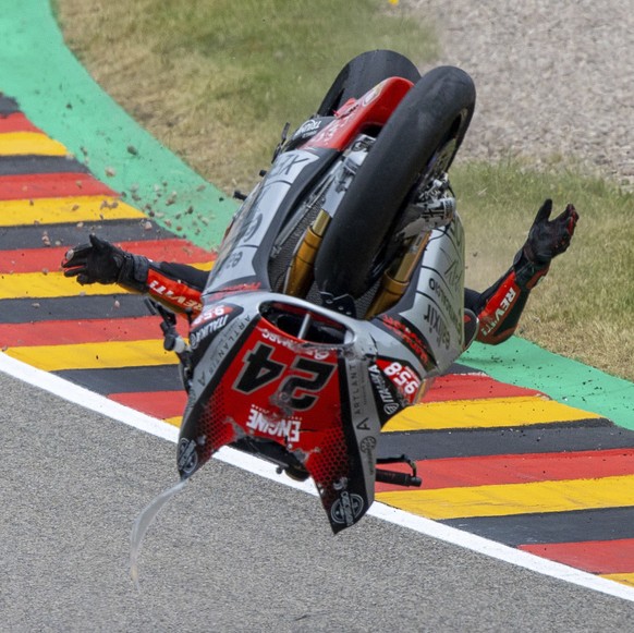 Rider Simone Corsi from Italy of Team Tasca Racing Scuderia crashes in the Moto2 race at the Sachsenring circuit in Hohenstein-Ernstthal, Germany, Sunday, June 20, 2021. (Jens B