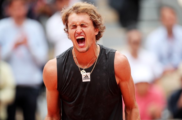 epa09975053 Alexander Zverev of Germany celebrates after winning the men&#039;s second round match against Sebastian Baez of Argentina during the French Open tennis tournament at Roland Garros in Pari ...