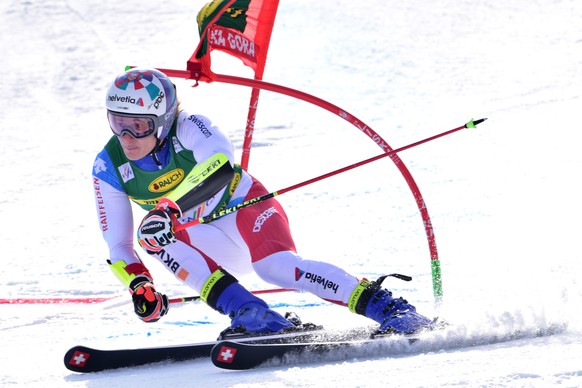 epaselect epa09071365 Marco Odermatt of Switzerland in action during the first run of the men&#039;s Giiant Slalom race of the FIS Alpine Skiing World Cup in Kranjska Gora, Slovenia, 13 March 2021. EP ...