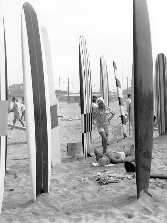 Surfboards planted in the sand at the Long Beach Surf Club in Long Beach, California, circa 1965. (Photo by American Stock Archive/Archive Photos/Getty Images)