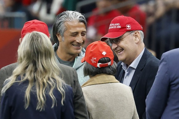 Switzerland's head coach Murat Yakin, left, talks to Swiss Federal President Guy Parmelin prior to the World Cup round of 32 soccer match between Switzerland and Algeria at the BC Place stadium i ...