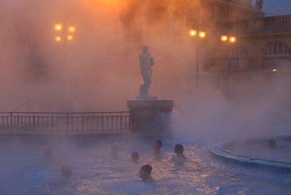 People relax at the Szechenyi Bath during a winter morning in Budapest, Hungary, January 10, 2017. REUTERS/Bernadett Szabo