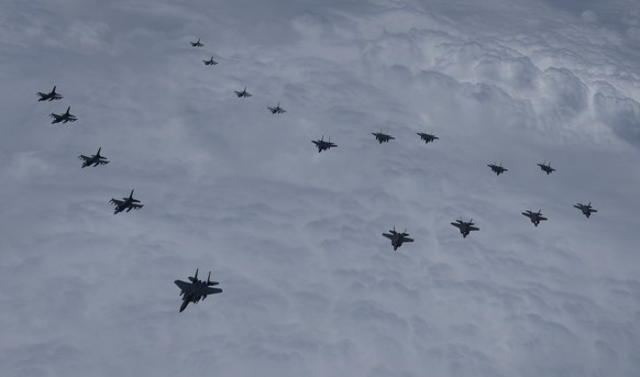 epa09999950 A handout photo made available by Seoul Joint Chiefs of Staff shows warplanes of South Korea and the United States, including F-35A stealth fighters, fly over the Yellow Sea off South Kore ...