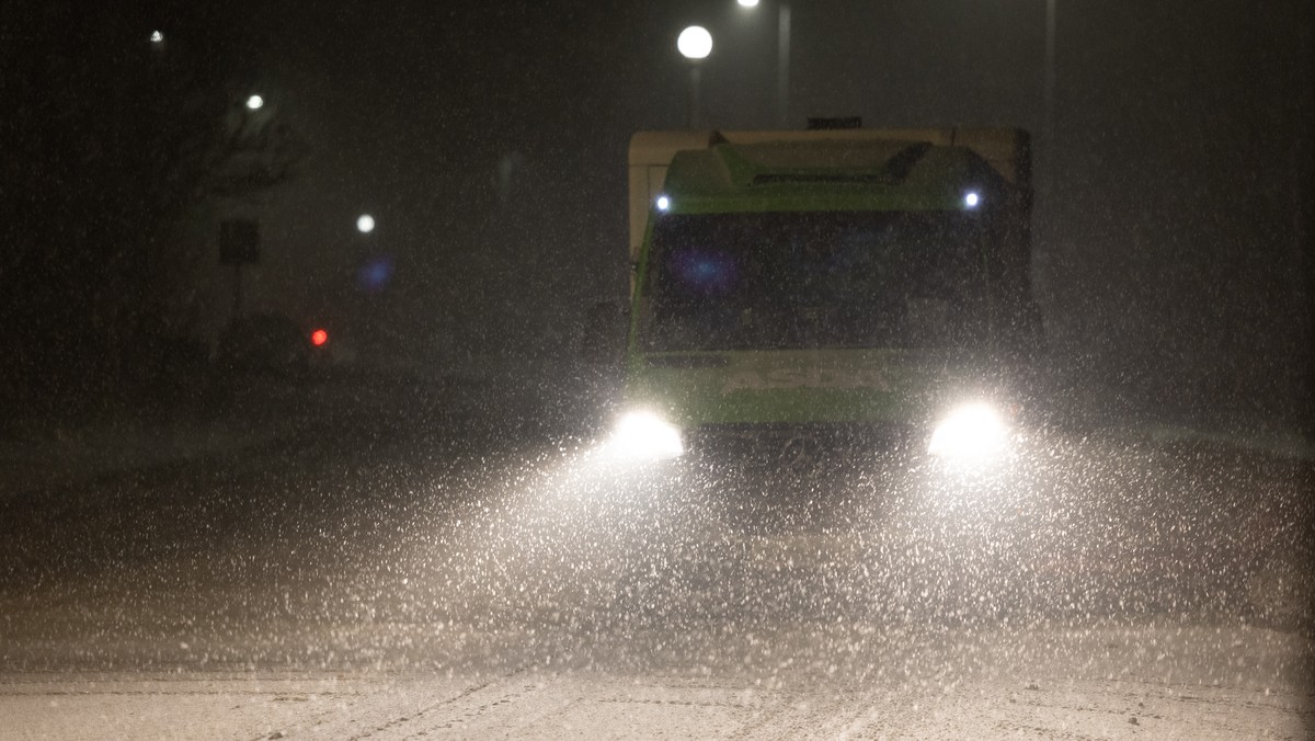 epa12637122 A motorist drives on a snow-covered road in Ruthin, Wales, Britain, 08 January 2026. The Met Office has issued yellow and amber warnings for ice, snow and wind across much of Britain as St ...