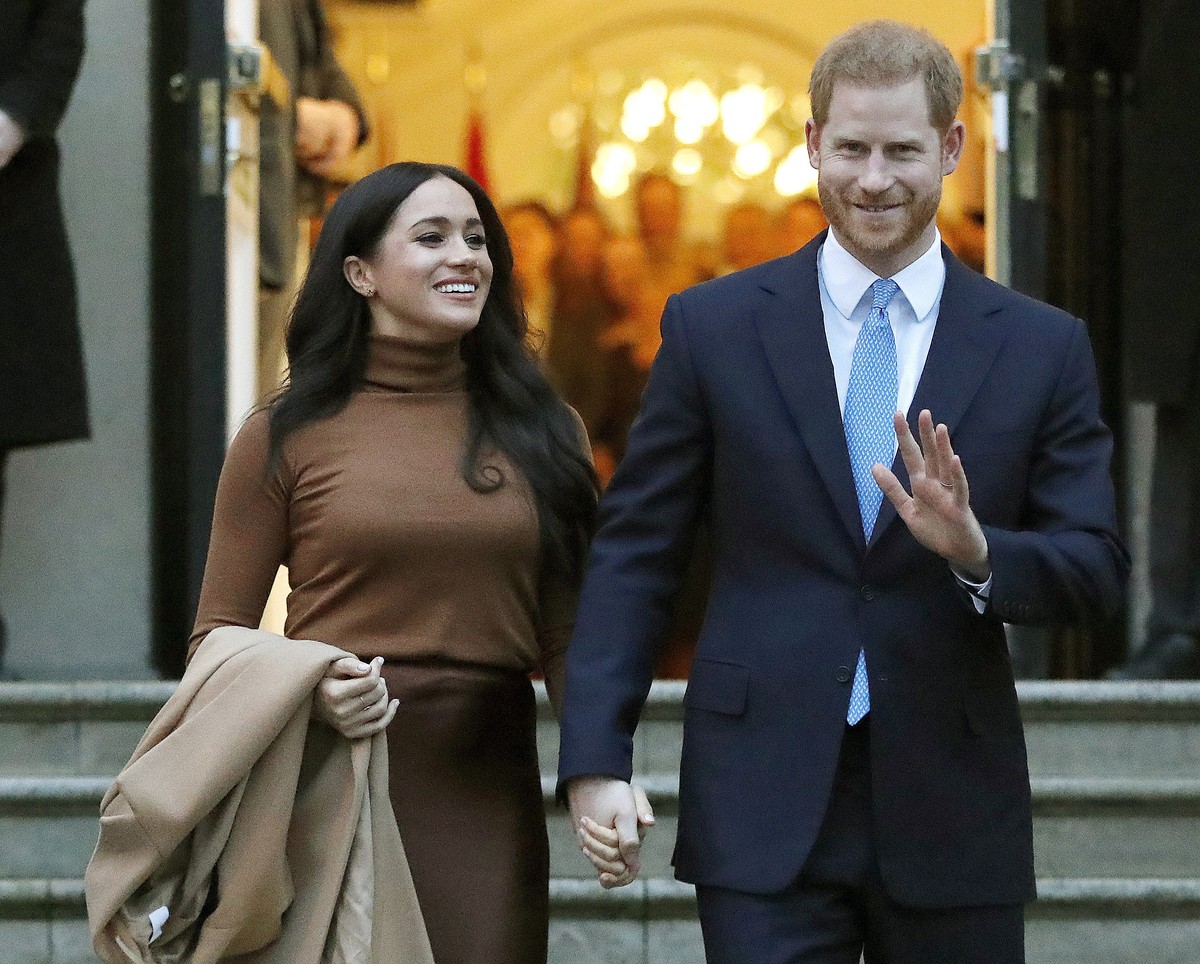 FILE - In this Jan. 7, 2020, file photo, Britain's Prince Harry and Meghan, Duchess of Sussex leave after visiting Canada House in London. Prince Harry and Meghan Markle have moved into a new fam ...