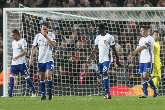 BaselÕs Michael Lang, Luca Zuffi, Dimitri Oberlin, Marek Suchy and goalkeeper Tomas Vaclik, from left, show dejection after Manchester&#039;s 3rd goal, during the UEFA Champions League Group stage Gro ...
