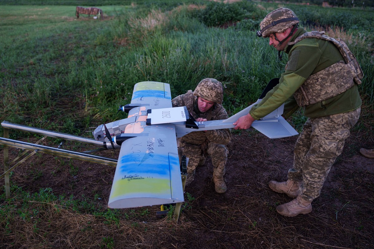 Ukrainian servicemen of K-2 brigade of the Unmanned Systems Forces prepare a midrange drone at takeoff position before flying towards Russian positions at the frontline in Donetsk region, Ukraine, Mon ...