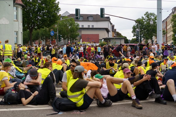 epa13087222 Demonstrators gather to protest against the Alternative for Germany (AfD) party holding its federal conference in Erfurt, Germany, 04 July 2026. The AfD will hold the 17th Federal Party Co ...