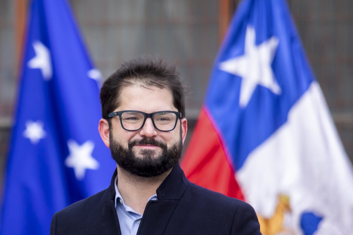 Chile's President Gabriel Boric stands outside a polling station during a press conference after casting his vote in a plebiscite on a new draft of the Constitution in Punta Arenas, Chile, Sunday ...