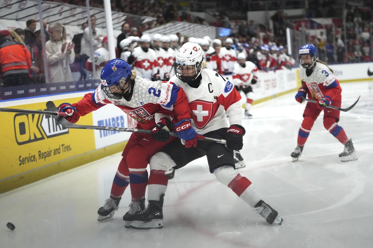 Lara Stalder of Switzerland, right, challenges Aneta Tejralova of Czech Republic during the quarterfinal match between Czech Republic and Switzerland at the Women's Ice Hockey Championships in Ce ...