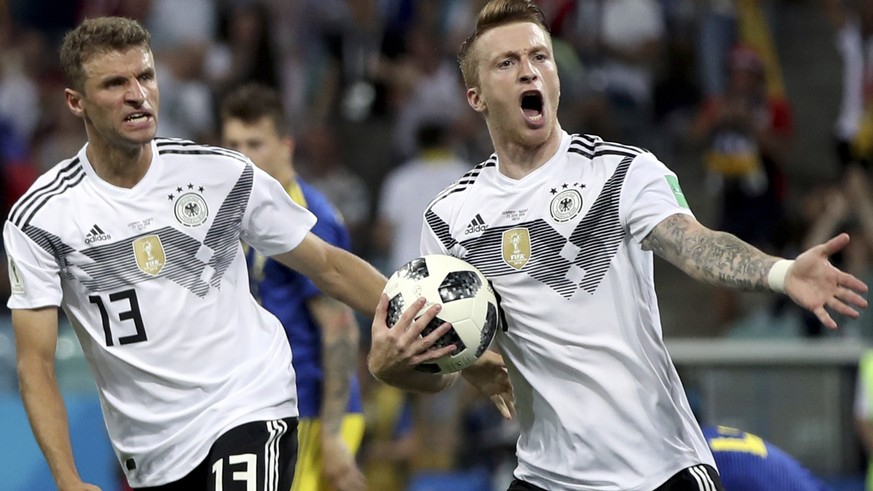 Germany&#039;s Marco Reus, right, celebrates with Thomas Mueller after scoring his side&#039;s opening goal during the group F match between Germany and Sweden at the 2018 soccer World Cup in the Fish ...