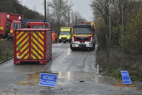 Emergency services attend to a large explosion at a warehouse in Bristol, England, Thursday Dec. 3, 2020. A local British emergency services department says there have been