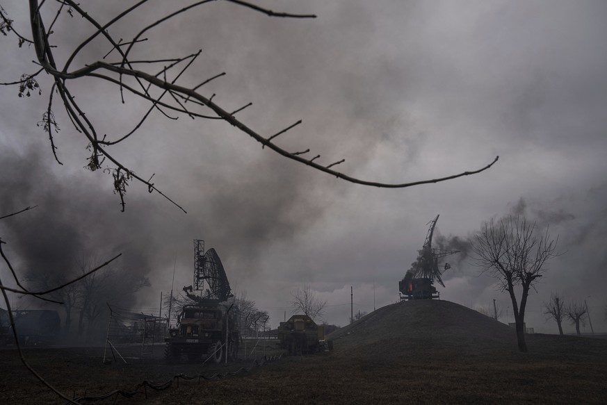Smoke rise from an air defence base in the aftermath of an apparent Russian strike in Mariupol, Ukraine, Thursday, Feb. 24, 2022. Russian troops have launched their anticipated attack on Ukraine. Big ...