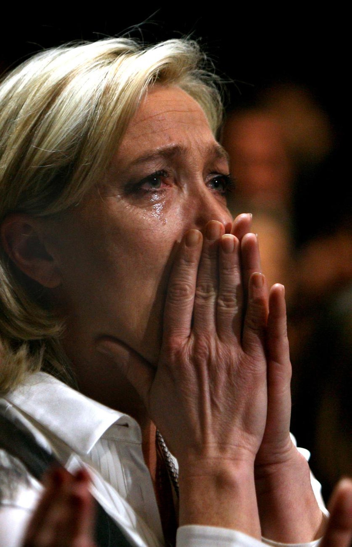 French far-right Marine Le Pen weeps at the national congress in Tours, western France, Saturday, Jan. 15, 2011. Marine Le Pen, the 42-year-old daughter of France's best-known far-right leader, J ...