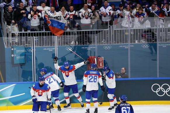 epa12734783 Slovakia's team celebrates after scoring a goal during the Men's Ice Hockey preliminary round match between Italy and Slovakia at the Milano Cortina 2026 Winter Olympic Games, in ...
