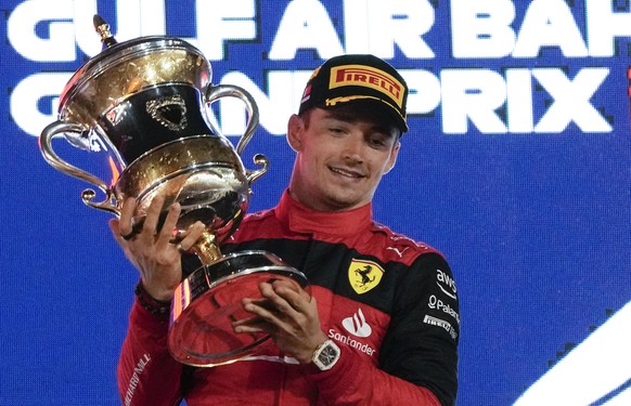 Ferrari driver Charles Leclerc of Monaco celebrates after he won the Formula One Bahrain Grand Prix it in Sakhir, Bahrain, Sunday, March 20, 2022. (AP Photo/Hassan Ammar)