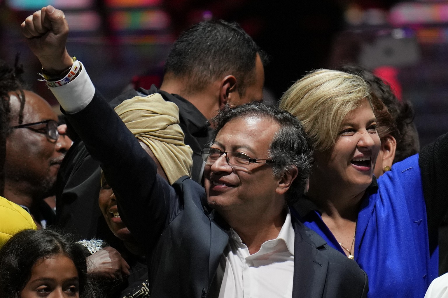 Former rebel Gustavo Petro and his wife Veronica Alcocer celebrate before supporters after winning a runoff presidential election in Bogota, Colombia, Sunday, June 19, 2022. (AP Photo/Fernando Vergara ...