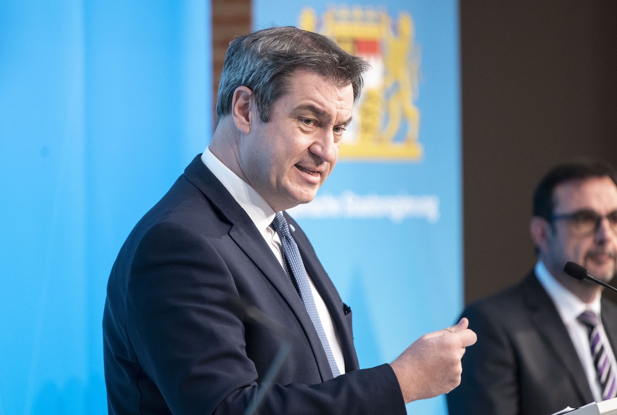 epa09091511 Bavaria's state premier Markus Soeder speaks during to a press conference after a meeting of the Bavarian cabinet in Munich, Bavaria, Germany, 23 March 2021. Germany extended and stre ...