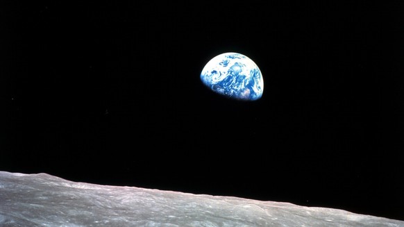 FILE - This Dec. 24, 1968, file photo made available by NASA shows the Earth behind the surface of the moon during the Apollo 8 mission. (William Anders/NASA via AP, File)