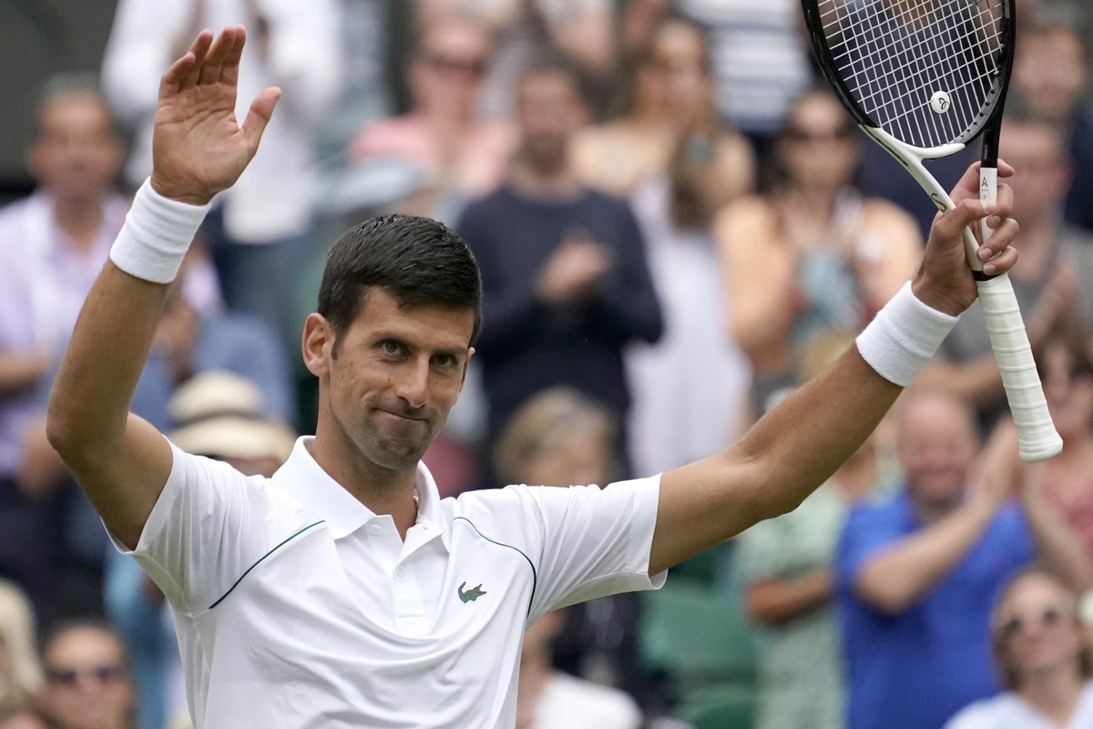 Serbia's Novak Djokovic celebrates defeating Serbia's Miomir Kecmanovic in a men's singles match on day five of the Wimbledon tennis championships in London, Friday, July 1, 2022. (AP P ...