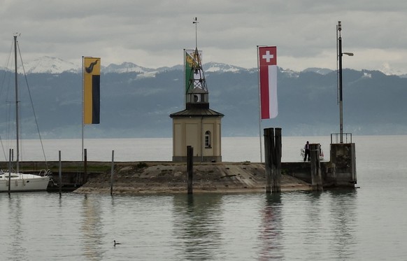 airship flying over the harbor in Romanshorn, Switzerland