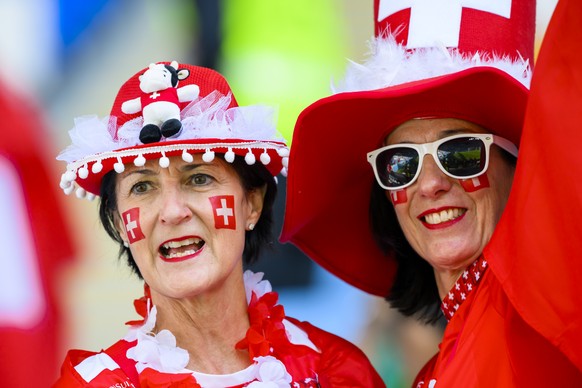 Two fans of the Swiss team react during the FIFA World Cup Qatar 2022 group G soccer match between Switzerland and Cameroon at the Al-Janoub Stadium in Al-Wakrah, south of Doha, Qatar, Thursday, Novem ...