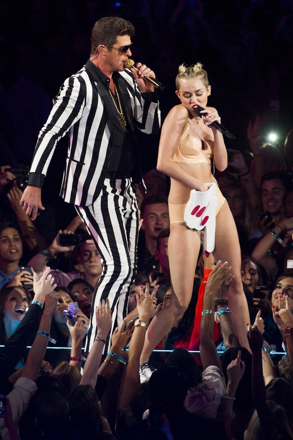 FILE - In this Aug. 25, 2013 file photo, Robin Thicke and Miley Cyrus perform at the MTV Video Music Awards at the Barclays Center in the Brooklyn borough of New York. Cyrus has been making noise for  ...