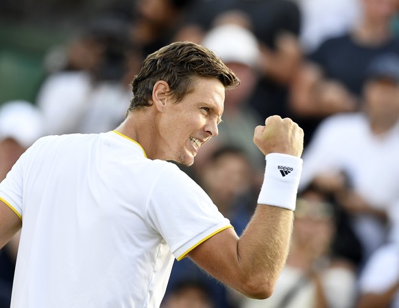 epa06079803 Tomas Berdych of the Czech Republic celebrates winning against Dominic Thiem of Austria during their fourth round match for the Wimbledon Championships at the All England Lawn Tennis Club, ...