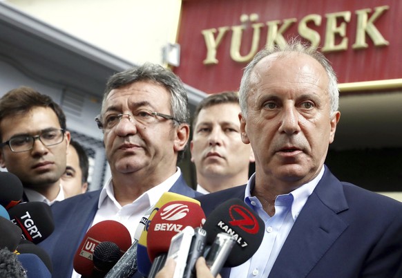 Muharrem Ince, the candidate of Turkey&#039;s main opposition Republican People&#039;s Party, right, speaks to the media outside High Electoral Board in Ankara, Turkey, Sunday, June 24, 2018. The poll ...