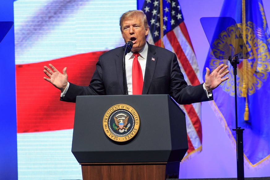 epa07125302 US President Donald J. Trump speaks to the Future Farmers of America convention at the Banker&#039;s Life Fieldhouse in Indianapolis, Indiana, USA, 27 October 2018. Trump has been criss-cr ...